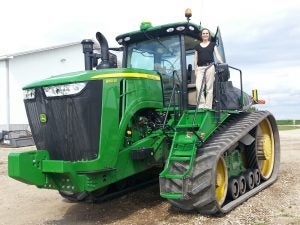 Green tractor on Iowa corn farm