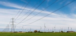 1024px-Wind_Turbines_and_Power_Lines,_East_Sussex,_England_-_April_2009