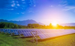 Solar panels surrounded by picturesque scenery.