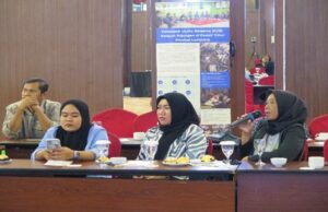 Women speaking at a meeting