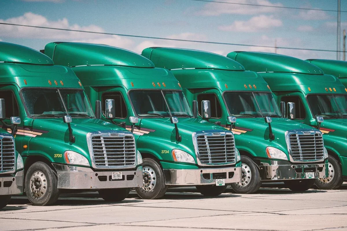 Fleet of green trucks