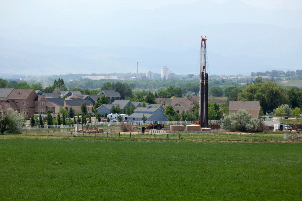 It's common to find oil and gas drill rigs in or very close to residential areas in Colorado's Front Range, like this one in the town of Frederick, which neighbors Broomfield (Getty Images photo).