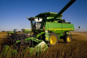 John Deere combine harvesting soybeans.