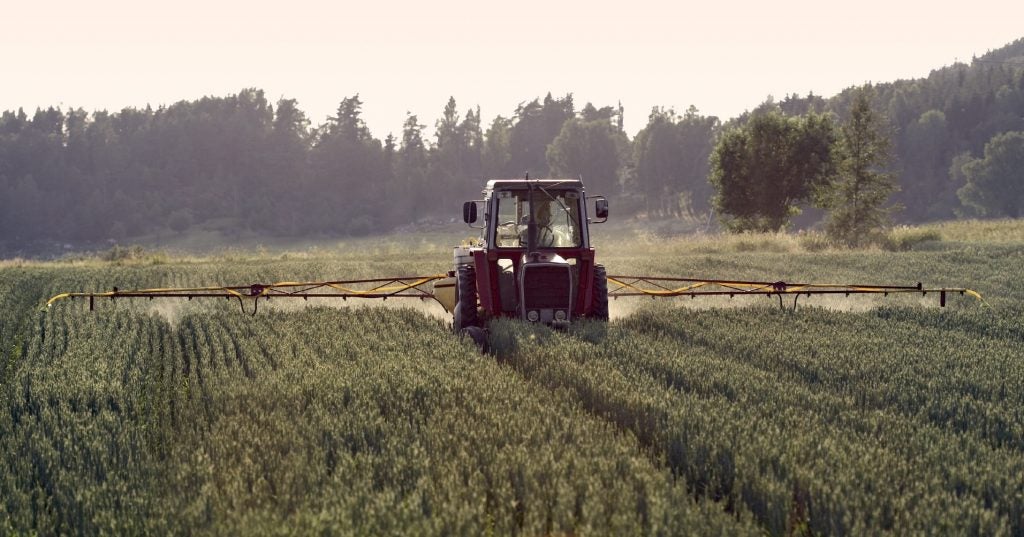 Tractor applying fertilizer
