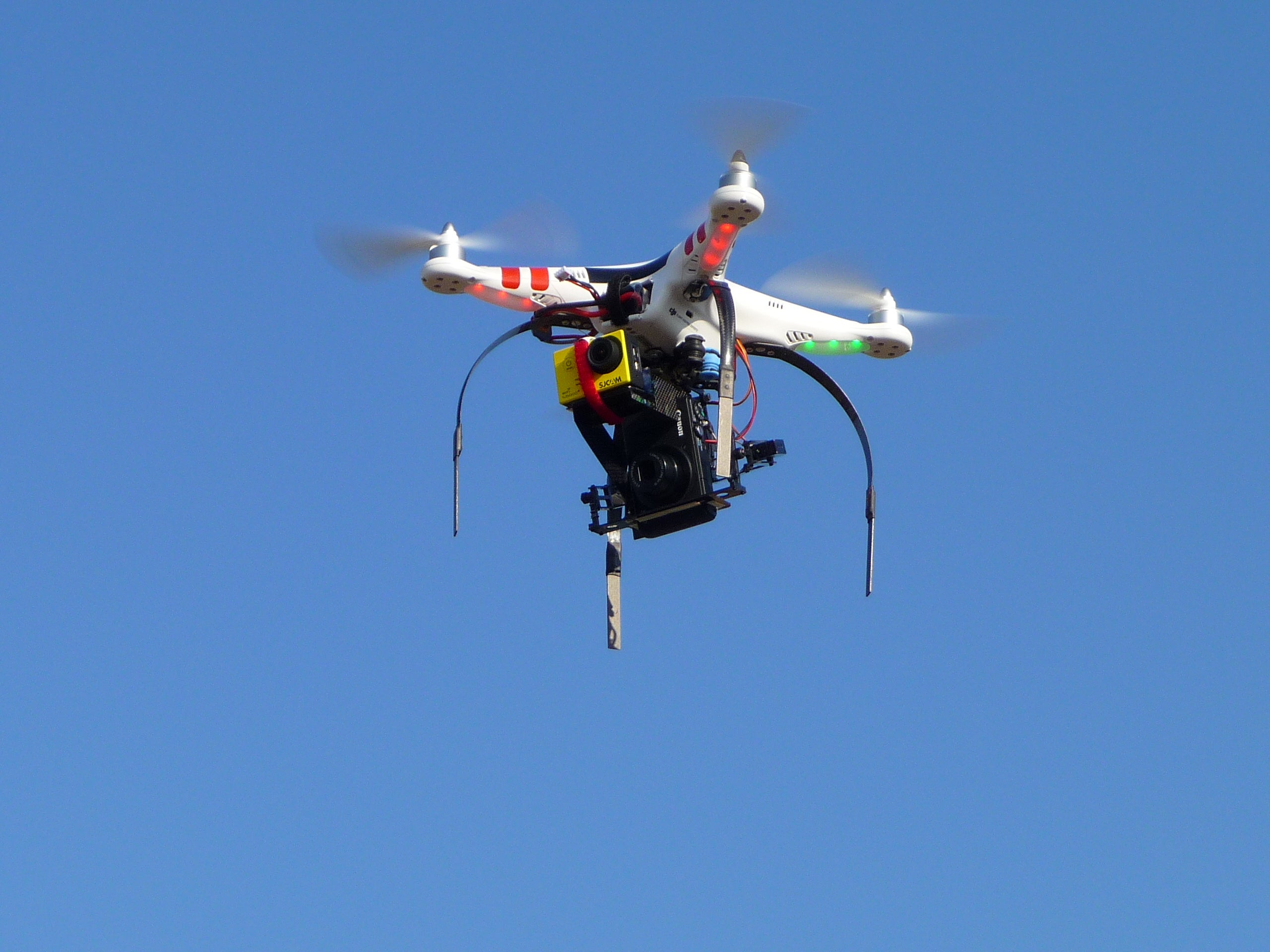 A quadricopter drone with an on-board camera. Photo credit: Flickr user Carlos Honda