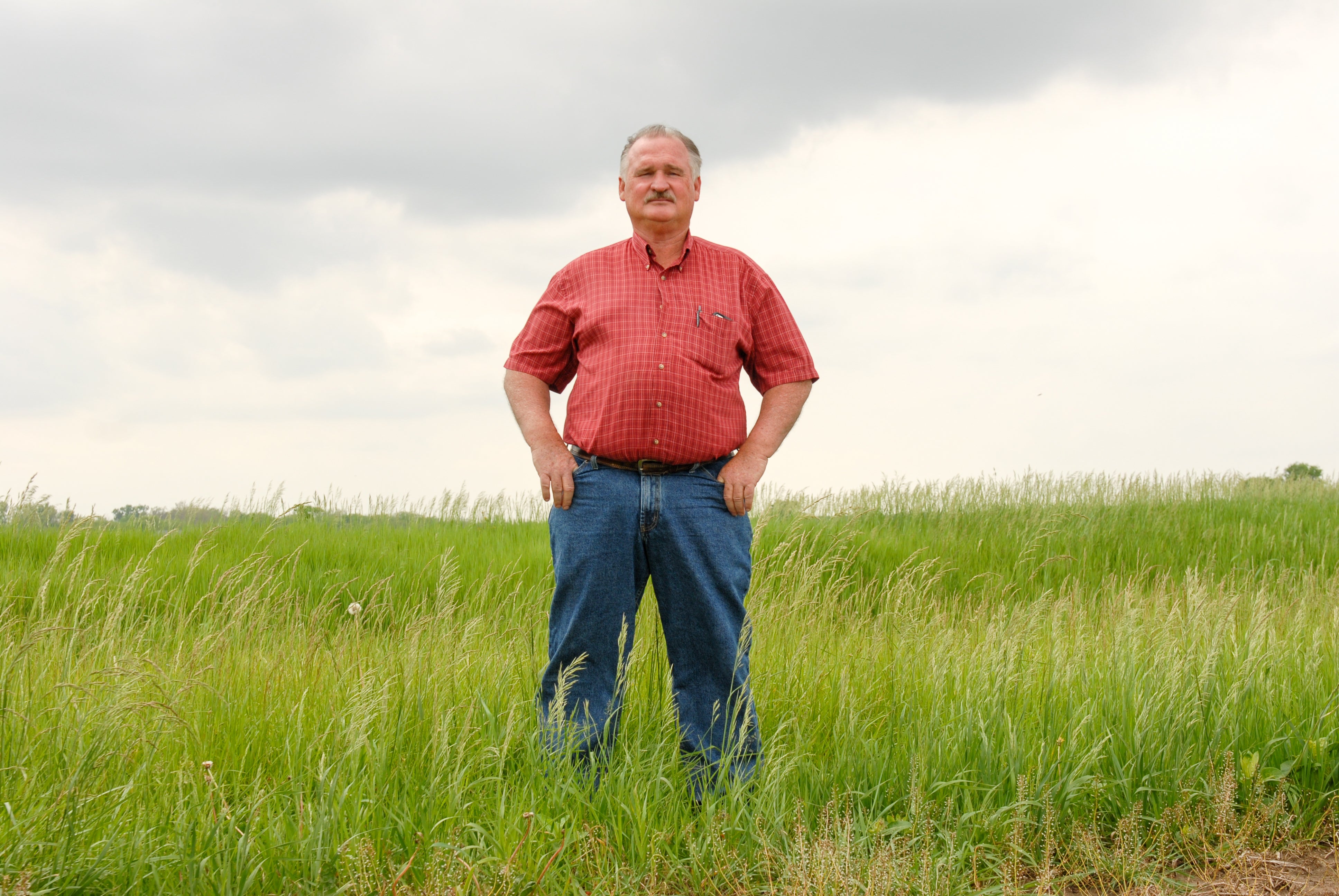 An Ohio farmer and climate advocate stares straight ahead