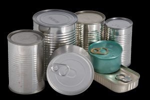 Pile of silver metal food cans with no labels