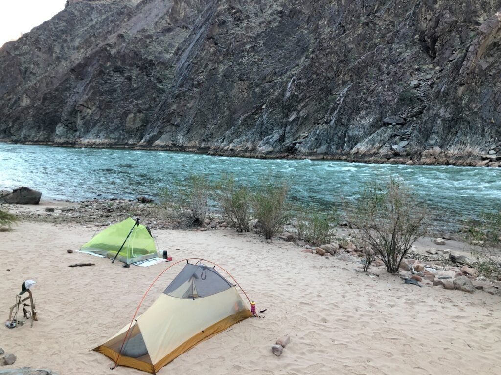 Camping tents on a beach along the Colorado River in the Grand Canyon.