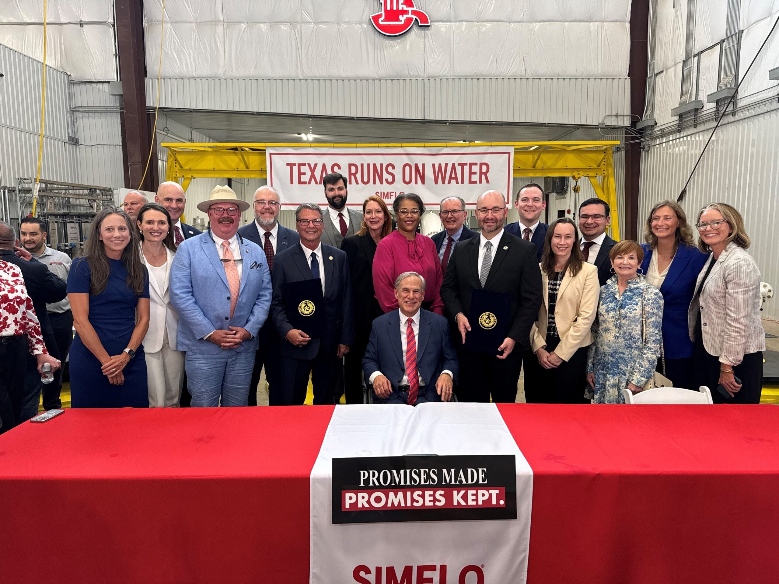 Texas Gov. Greg Abbott and water and water stakeholders at signing ceremony
